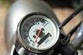 Vintage speedometer on a retro motorcycle. Speed arrow close-up Royalty Free Stock Photo