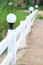 Vintage Spherical lamps on white wooden fence decoration for Walkway lights in garden