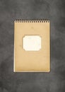 Vintage spiral close notebook on concrete background