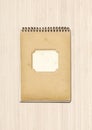 Vintage spiral close notebook on white wooden background Royalty Free Stock Photo