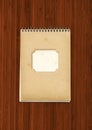 Vintage spiral close notebook on dark wooden background