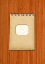 Vintage spiral close notebook on dark wooden background Royalty Free Stock Photo