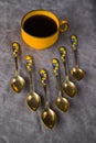 Vintage spoons, silverware, black coffee cup on the table Royalty Free Stock Photo