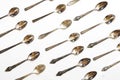 Vintage spoons, silverware pattern on white background. Kitchen texture. Top view. Royalty Free Stock Photo