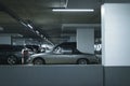 Vintage sports car on parking lot in garage. Royalty Free Stock Photo