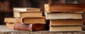 The vintage stack of books on a rustic wooden table showcasing literary treasures..AI generated image Royalty Free Stock Photo