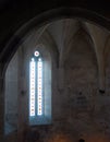 Vintage stained-glass window in old castle interior Royalty Free Stock Photo