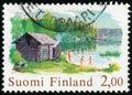 Vintage stamp printed in Finland 1977 show house on the beach