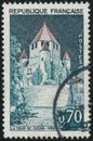 Vintage stamp printed in France circa 1964 shows Cesar Tower