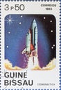 Vintage stamp printed in Guinea-Bissau shows Space Shuttle launch