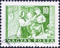 2020. Vintage stamp printed in Hungary shows Girl pioneer and woman letter carrier, Transport and Telecommunication serie