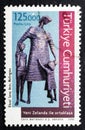 2021. Vintage stamp printed in Turkey shows mother with children, sculpture from Lyndon Smith displayed at the war museum of Welli