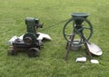 Vintage stationary engine grinding corn on grass