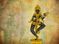 Vintage statue of Indian Goddess Saraswati isolated on the textured background