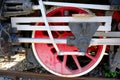 Vintage steam locomotive detail with cranks and red wheels Royalty Free Stock Photo