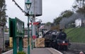 Vintage steam train coming into the platform at Swanage railway station, Dorset UK.