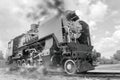 Vintage steam train hurtling at speed along the rails close-up Royalty Free Stock Photo