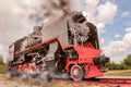 vintage steam train hurtling at speed along the rails close-up Royalty Free Stock Photo