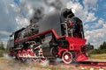 vintage steam train hurtling at speed along the rails close-up, retro vehicle, steam Royalty Free Stock Photo