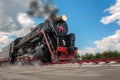 vintage steam train hurtling at speed along the rails close-up, retro vehicle, steam Royalty Free Stock Photo