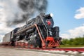 vintage steam train hurtling at speed along the rails, retro vehicle, steam Royalty Free Stock Photo