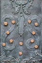 Vintage steel door decorated with wrought iron, pattern fragment of door to the cathedral in Lviv Royalty Free Stock Photo