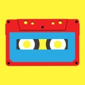 Red stereo compact cassette on a yellow background