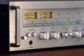 Vintage Stereo Receiver Front Panel with Controls Side View Closeup