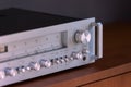 Vintage Stereo Receiver Standing on the Wooden Sideboard, Side View Royalty Free Stock Photo