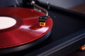 Vintage Stereo Turntable Plays Red Vinyl Record Album, Tonearm with Headshell Royalty Free Stock Photo