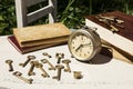 Vintage still life with old alarm clock, keys and books