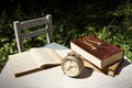 Vintage still life with old alarm clock, keys and books