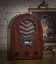 Vintage still life of an old analogue wooden radio and golden fr Royalty Free Stock Photo