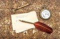 Vintage still life with old postcards, pocket watch, key and feather pen Royalty Free Stock Photo