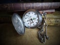 Vintage still life. Pocket watch and old book Royalty Free Stock Photo