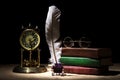 Vintage still life with retro glasses on old books near inkstand, feather, old clock against black background under beam of light.