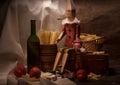 Vintage still life with spaghetti and Pinocchio Royalty Free Stock Photo