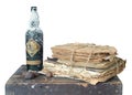 Vintage still life with stack of books and whiskey bottle Royalty Free Stock Photo