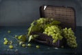 White grapes, bottles of wine and a glass of wine