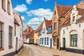 Vintage street in Bruges Belgium with blue