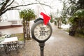 Vintage street clock with title Happy New Year 2018 and Santa Claus hat on them in town park Royalty Free Stock Photo