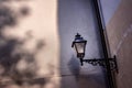 Vintage street lamp on the background of old wall. Royalty Free Stock Photo