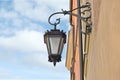 Beautiful vintage street lamp hanging on wall of building Royalty Free Stock Photo