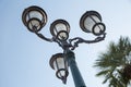 Vintage street light.black street lamp in an open blue sky . Street lantern on background blue sky . Old street light Royalty Free Stock Photo