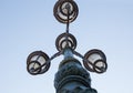 Vintage street light.black street lamp in an open blue sky . Street lantern on background blue sky . Old street light Royalty Free Stock Photo