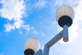 Vintage street lights under White clouds in a blue sky under the rays of the sun Royalty Free Stock Photo