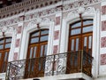 Vintage stucco facade with balcony, Cuenca, Ecuador Royalty Free Stock Photo