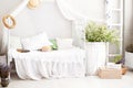 Vintage studio apartment interior in light colors in old style. Shabby white chic bedroom interior for a country house. Interior i Royalty Free Stock Photo