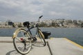 Vintage style bicycle standing on Pier of marina Zeas, opposite of Pasalimani city in Piraeus, Greece