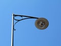 Vintage style bright white street lamp. blue sky background Royalty Free Stock Photo